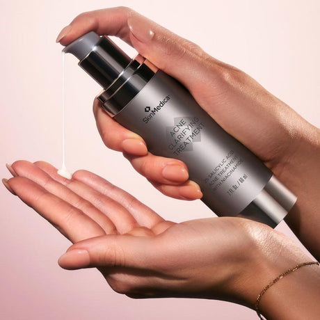 SkinMedica Acne Clarifying Treatment texture of product on model hands